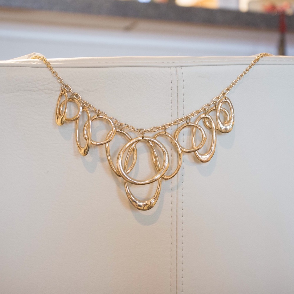 Gold hoop necklace unknown material